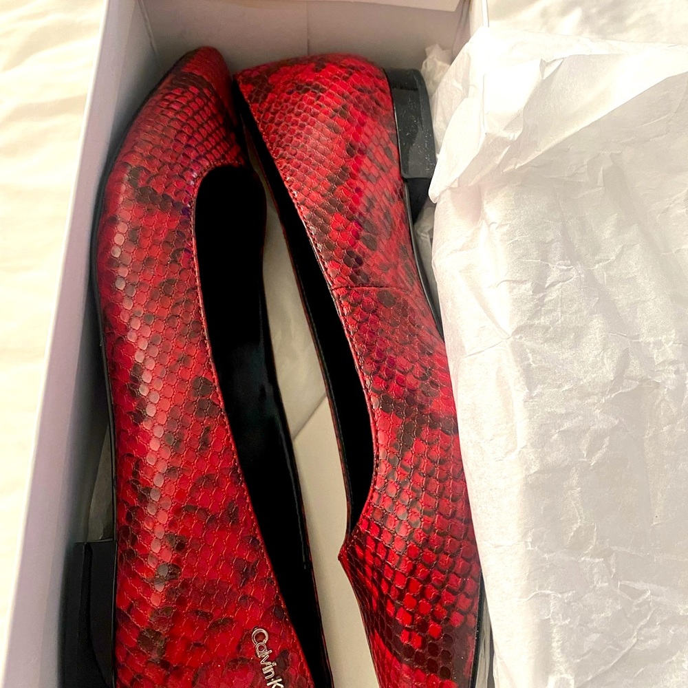 Red printed snake print flats by Calvin Klein